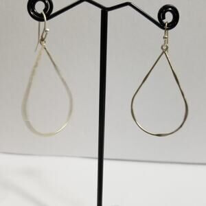 Silver tone pierce teardrop shaped hoop earrings 1 1/2" drop